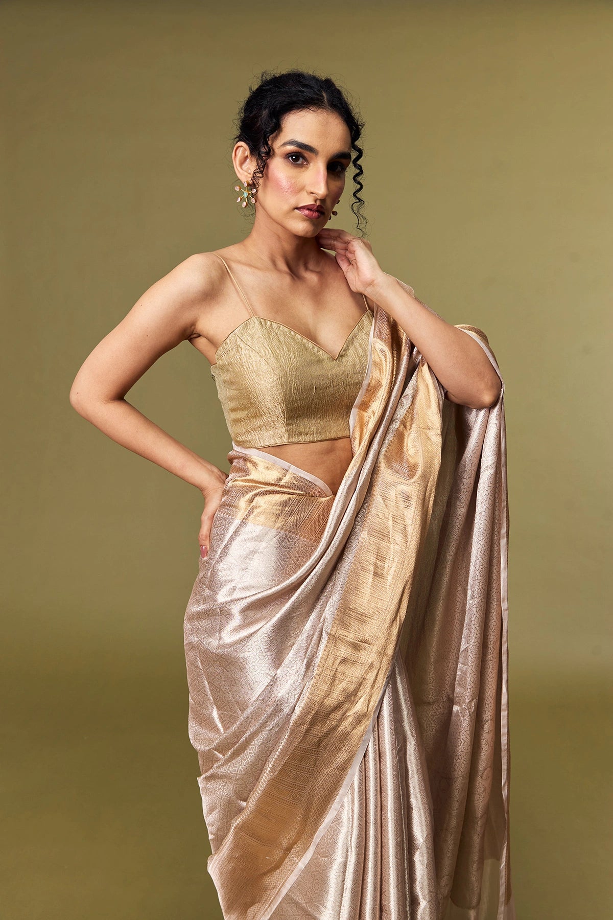 Delicate brocade pattern on shimmering tissue silk fabric