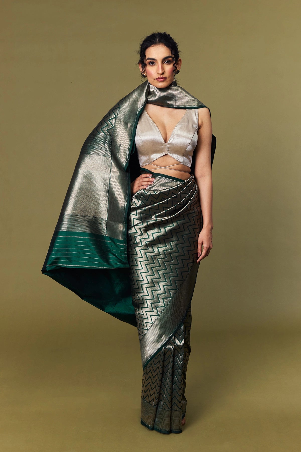 All-over zig-zag zari weave on emerald green Banarasi silk fabric