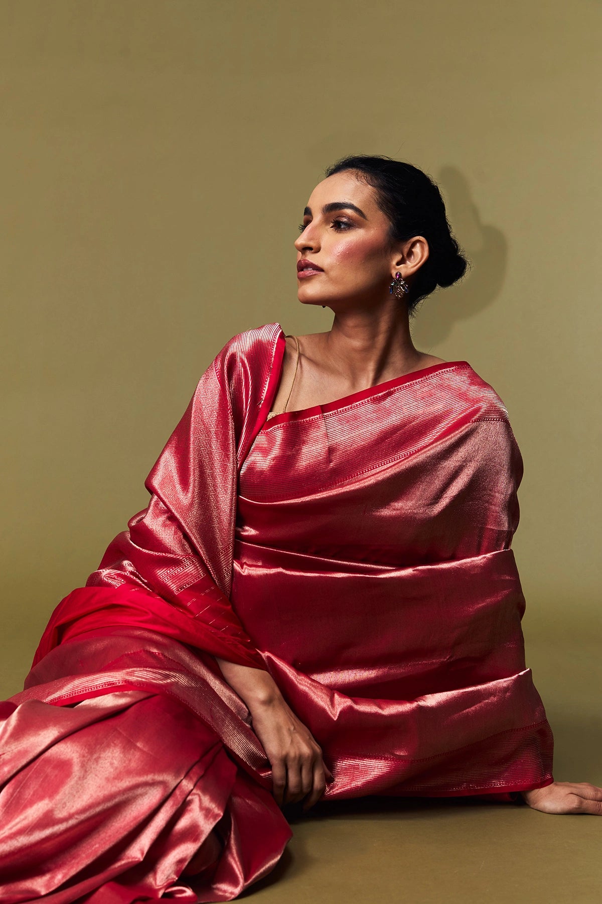 Close-up of pallu in crimson pink Banarasi saree with fine zari weave