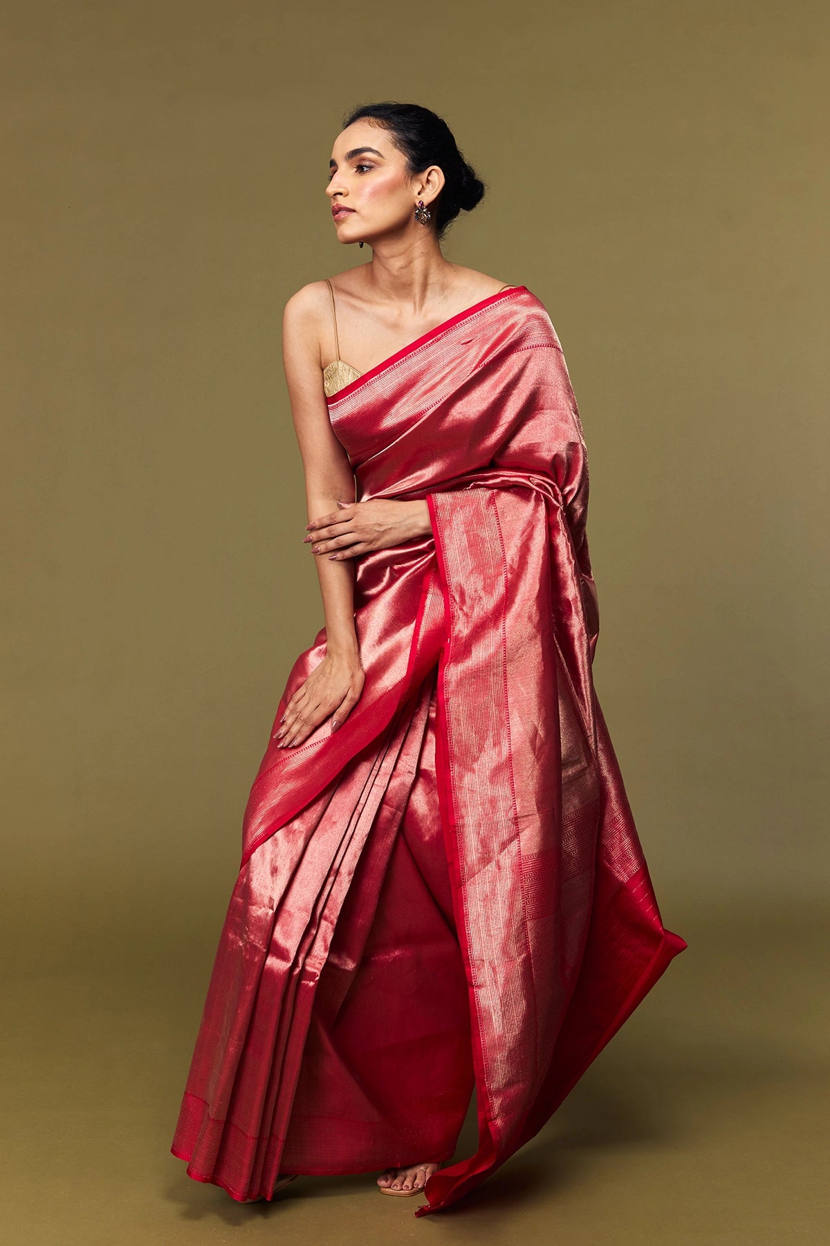 Model draped in crimson blush Tanchoi Banarasi silk saree with subtle sheen
