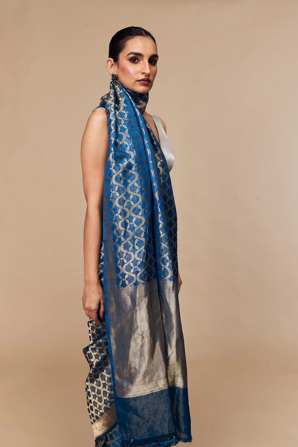 Smooth satin tissue texture with circular gold zari jaal