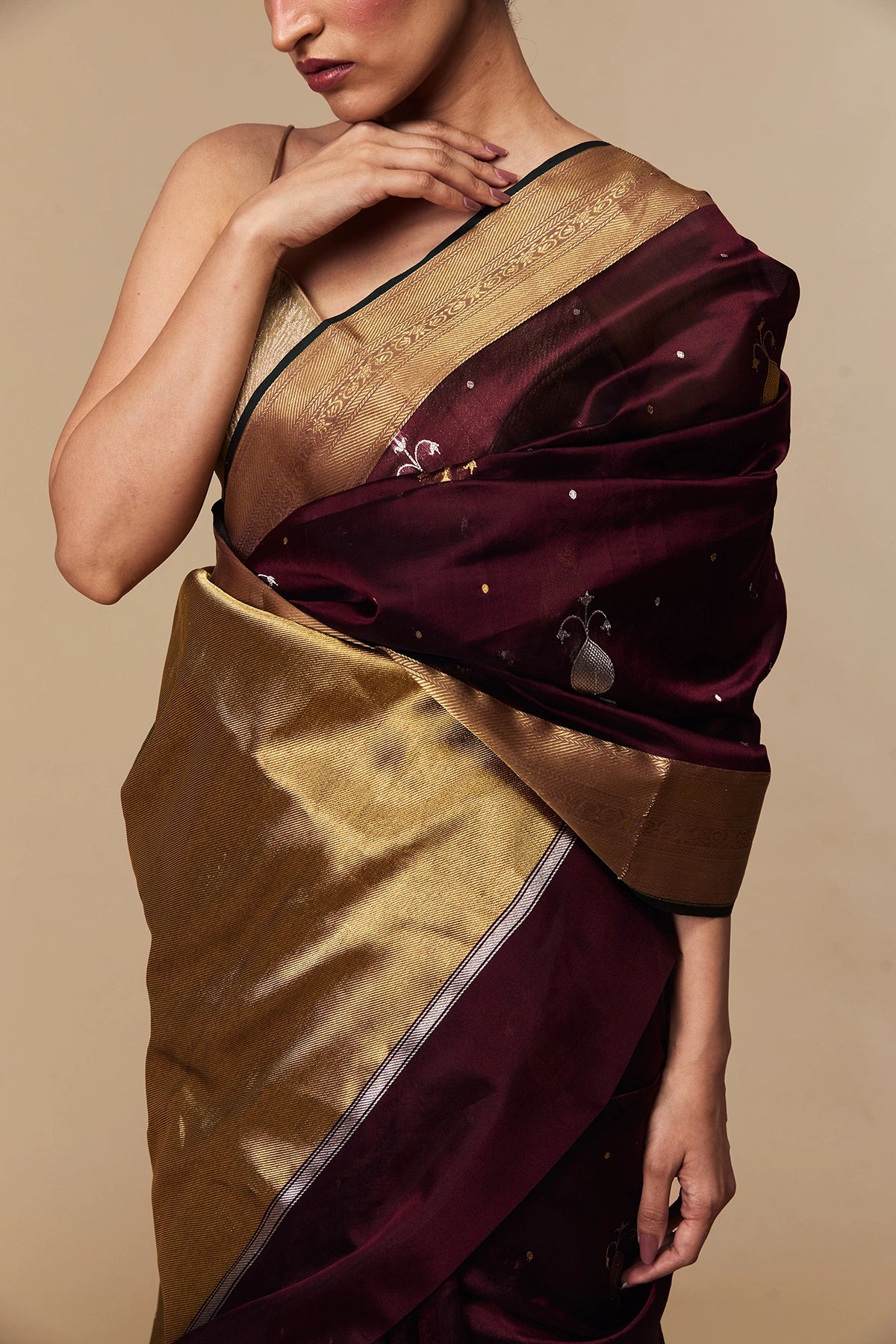 Close-up of maroon Chanderi silk saree with gold zari pallu