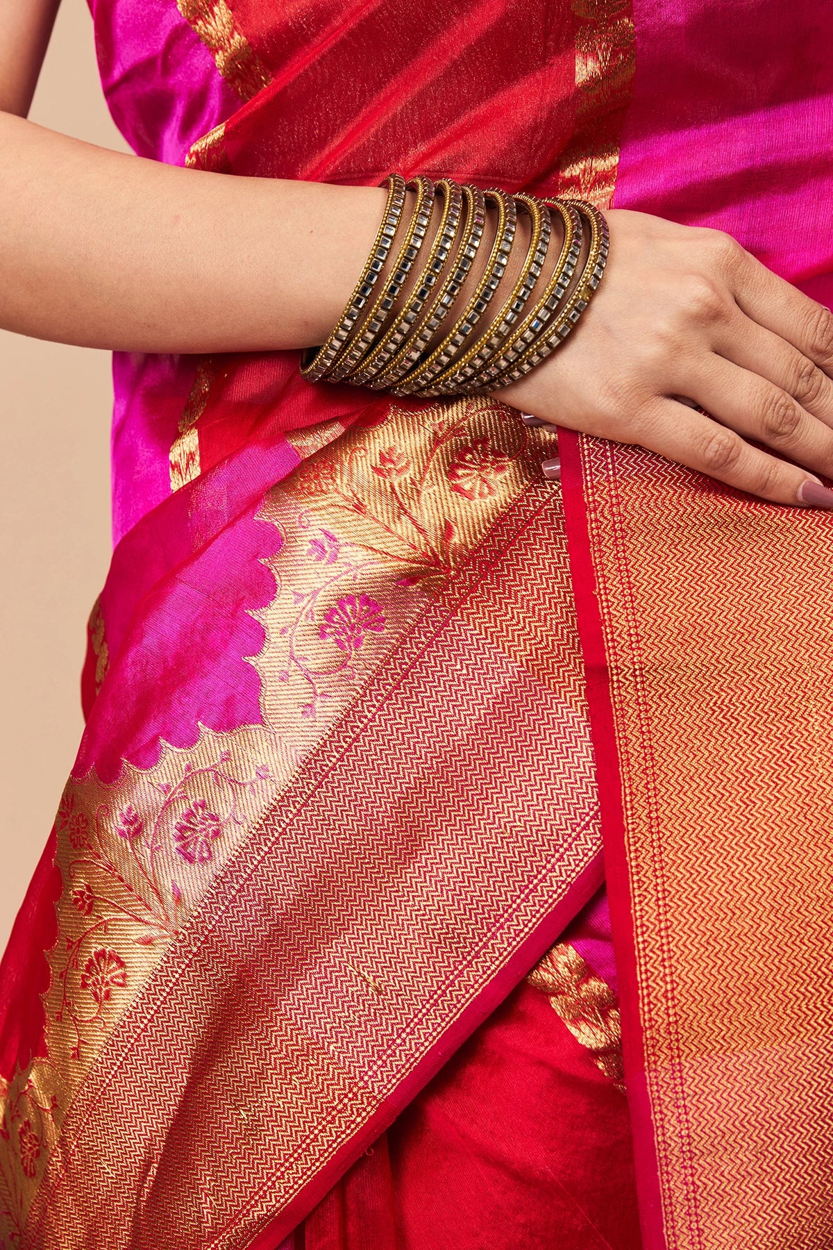 Close-up of floral zari weaving on pink Chanderi silk saree