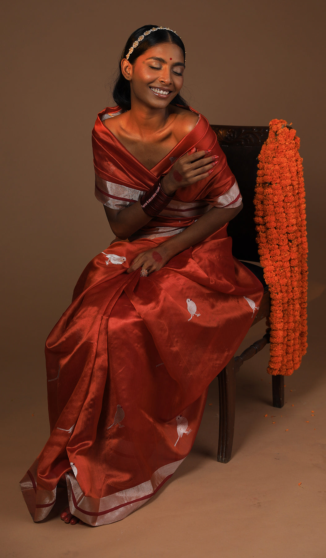 Rust Pattu Silk Saree with Majestic Golden Zari Border