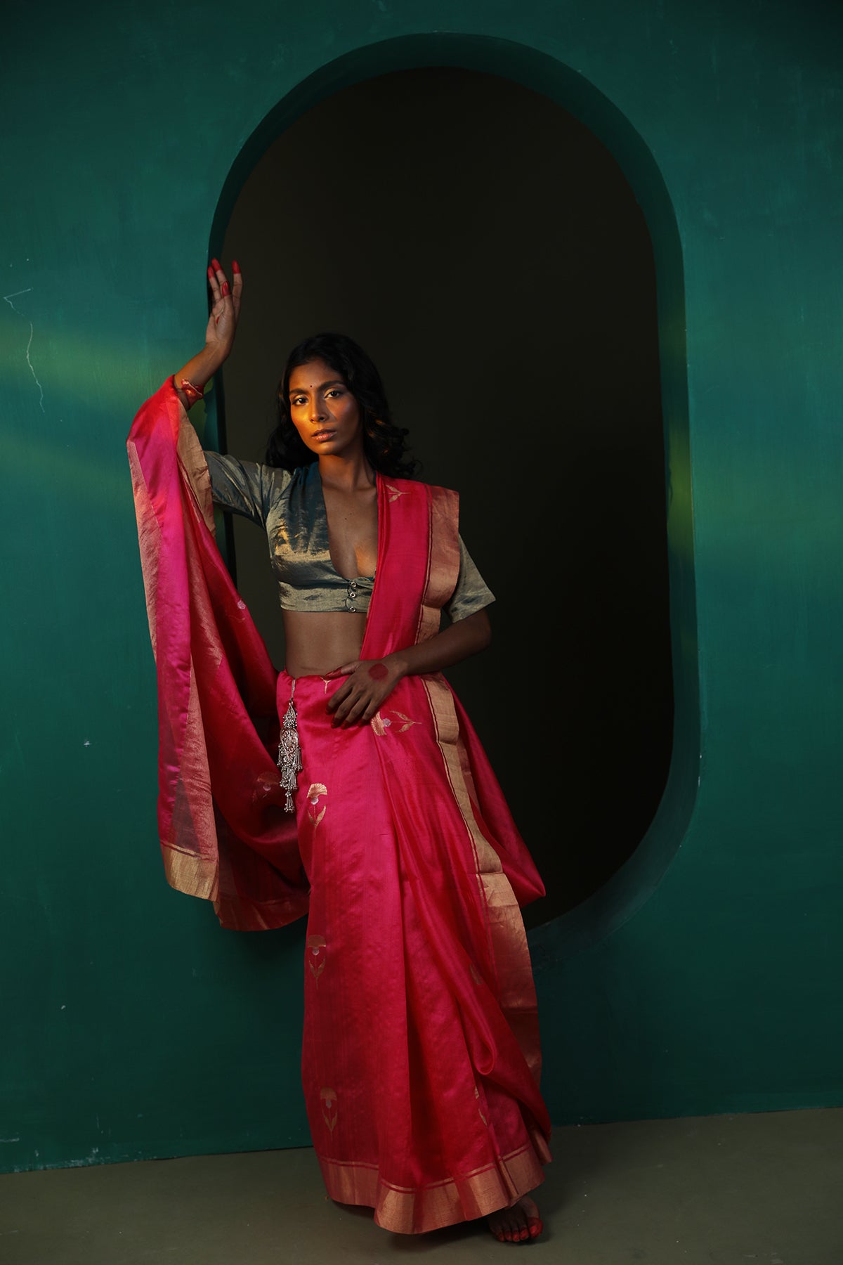 Image of a red Pattu Soft silk saree with Chanderi weaving and gold butta all over.