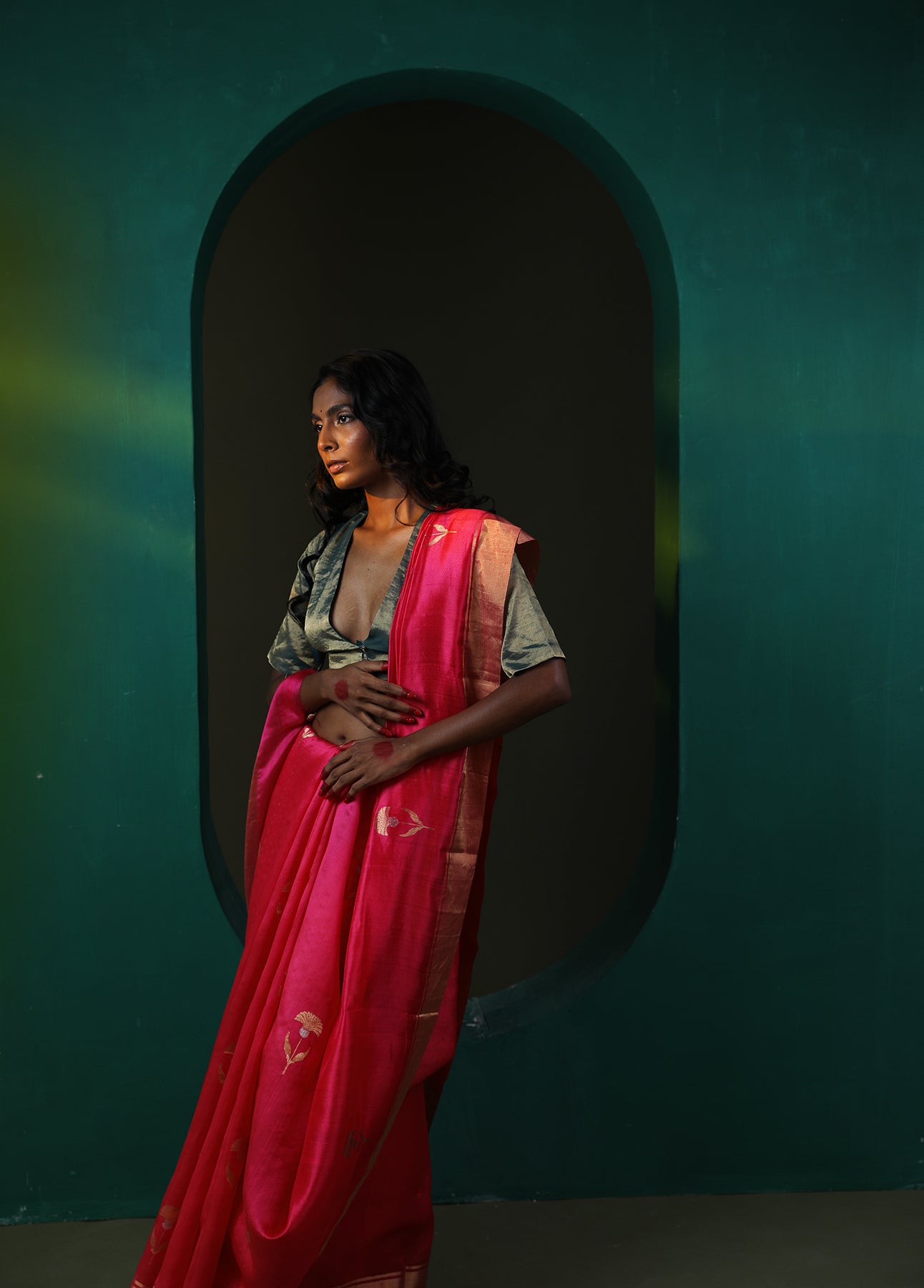 Image of a red Pattu Soft silk saree with Chanderi weaving and gold butta all over.