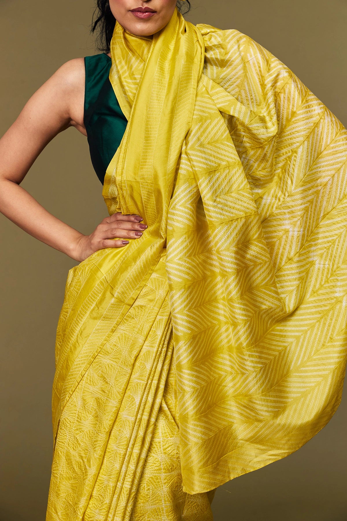 Close-up of yellow Shibori pallu pattern