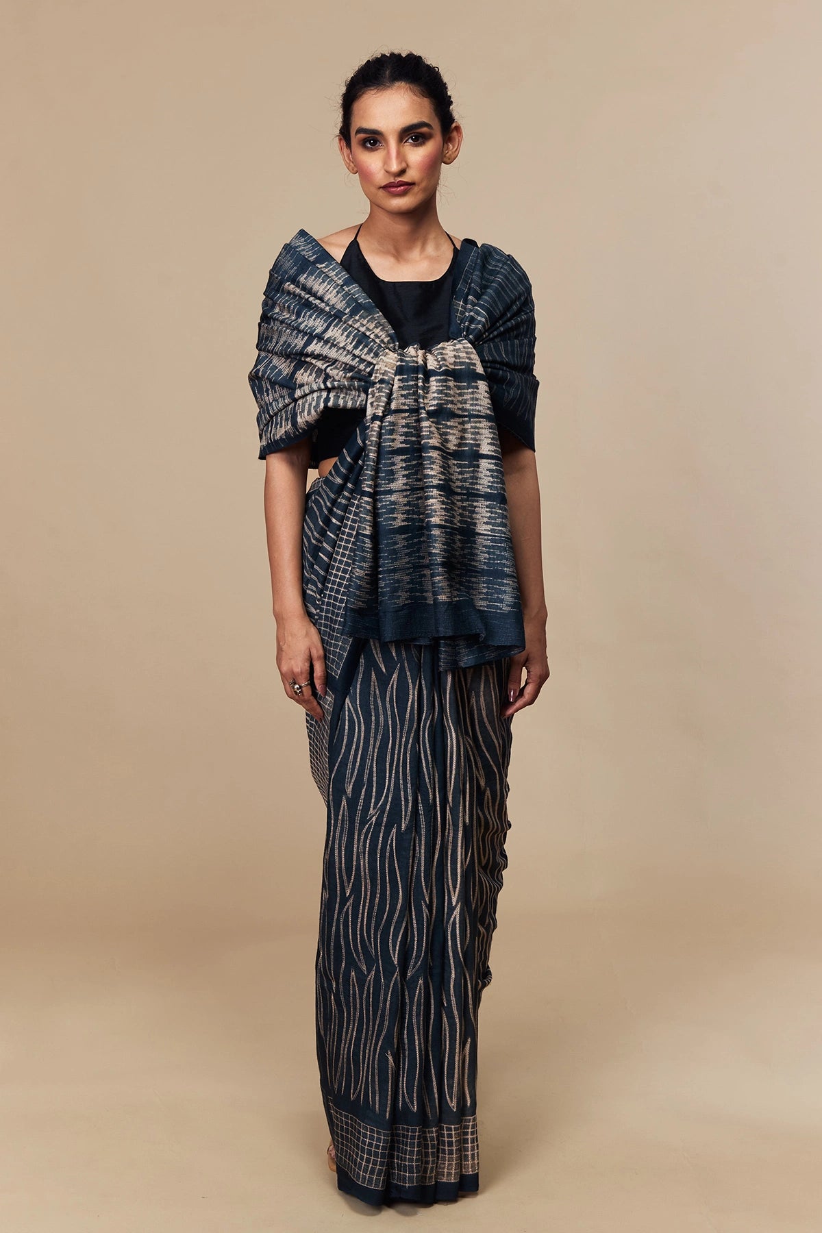 Close-up of Shibori pallu showing wave and grid patterns