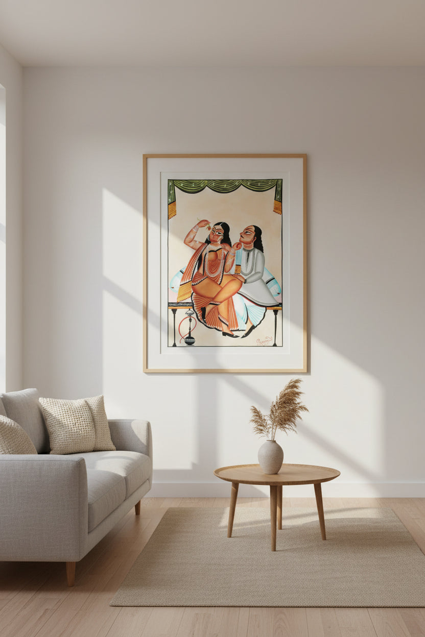 A traditional Indian folk art painting depicting a seated couple in ornate clothing, with a woman in an orange sari and a man in a white tunic, on a cream background with a green patterned curtain at the top.