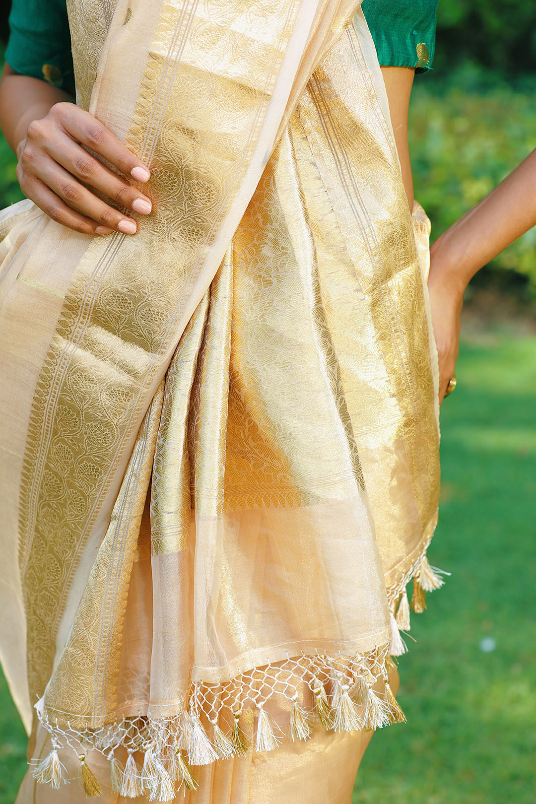 Pure tissue saree with zari border, booties all over