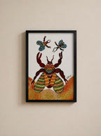 A framed art print featuring a colorful, patterned beetle and two butterflies on a white background, housed in a black frame and mounted on a beige wall.