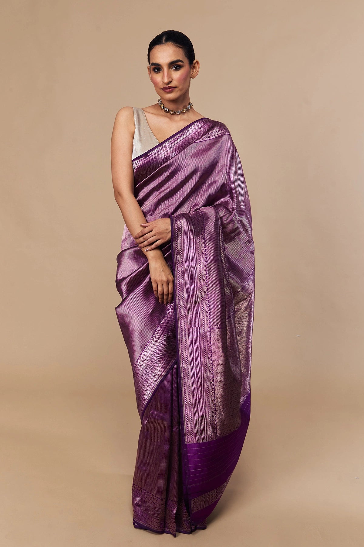 Model draped in violet Tanchoi Banarasi silk saree with subtle brocade texture