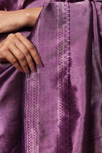 Close-up of violet Banarasi saree pallu with self-zari weave
