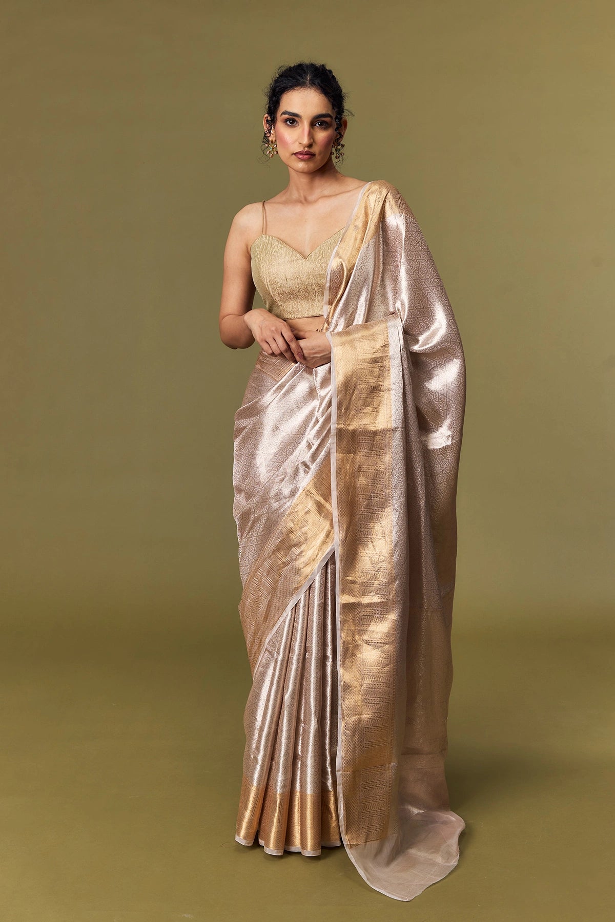 Model draped in champagne gold tissue Banarasi saree with zari border