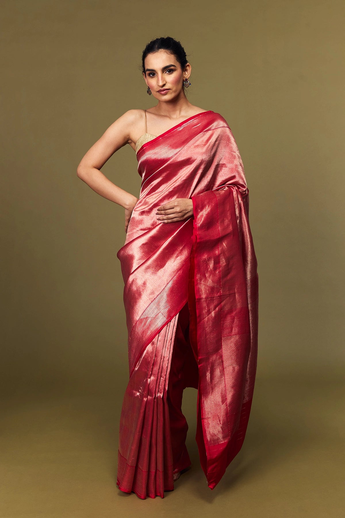 Model draped in crimson blush Tanchoi Banarasi silk saree with subtle sheen