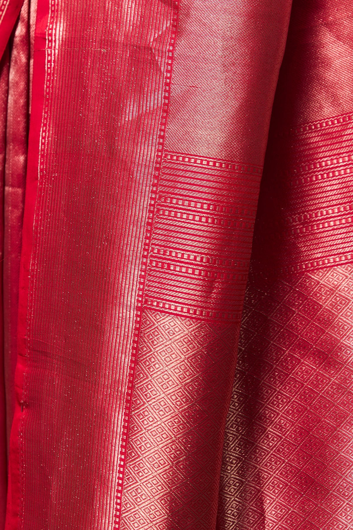 Close-up of pallu in crimson pink Banarasi saree with fine zari weave