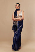 Model draped in navy blue Kadwa Banarasi saree in pure Katan silk with silver zari