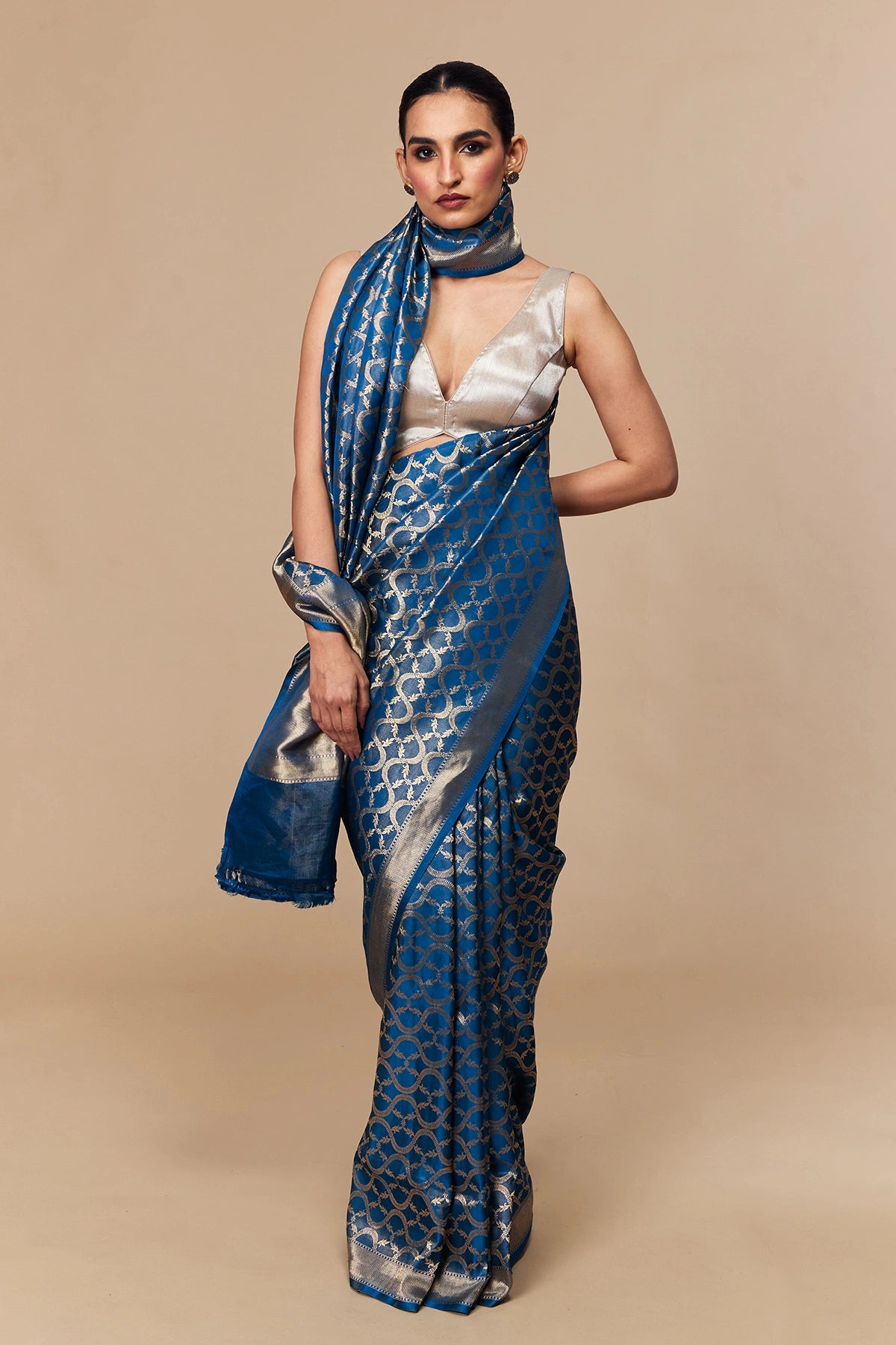 Gold zari border with metallic sheen on azure satin tissue saree