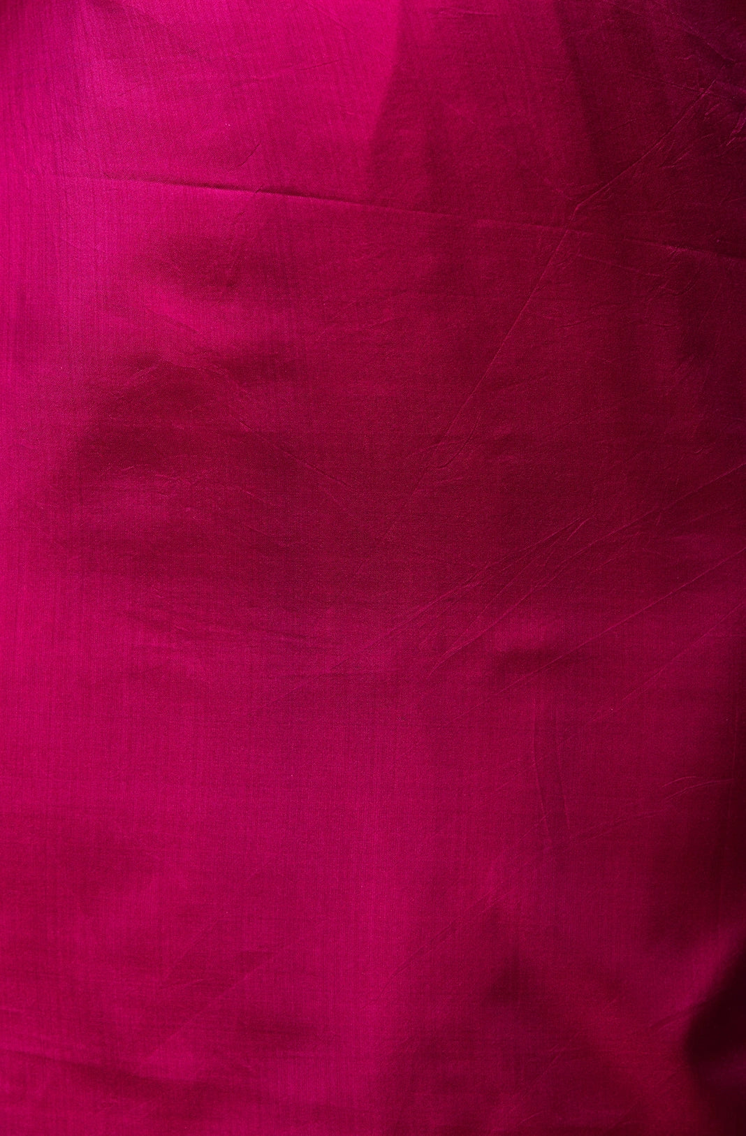 Unstitched blouse piece in matching purple silk included with the saree.