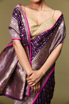 Traditional floral motifs and golden threadwork woven on the pure Katan silk fabric.