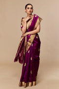 Model wearing magenta Chanderi silk saree with zari border