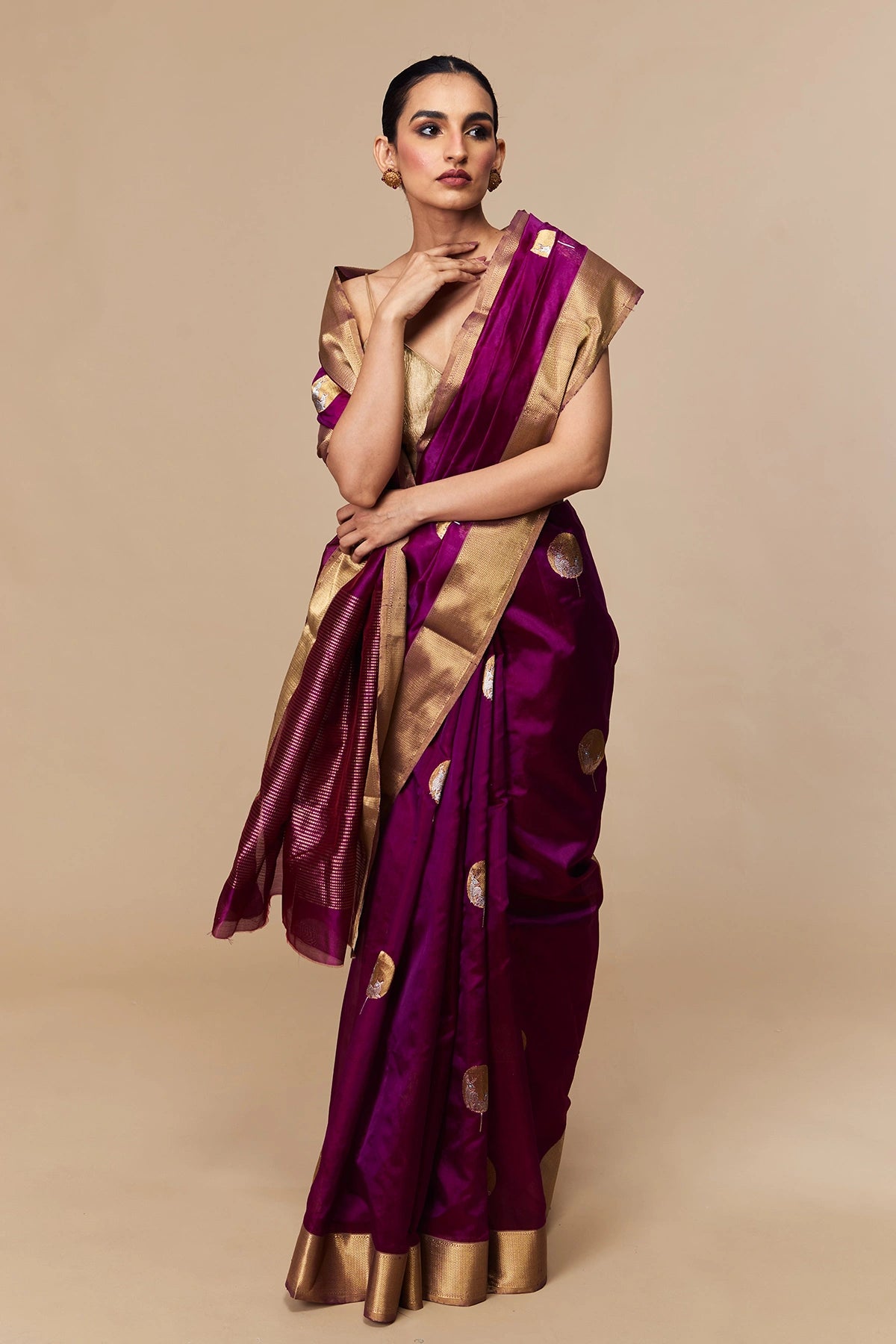 Model wearing magenta Chanderi silk saree with zari border