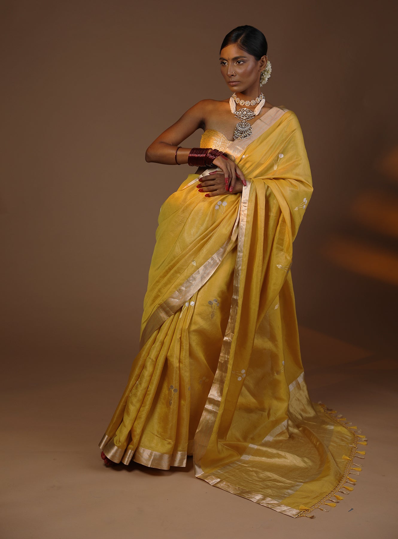 A Vibrant Yellow Tissue Silk Saree