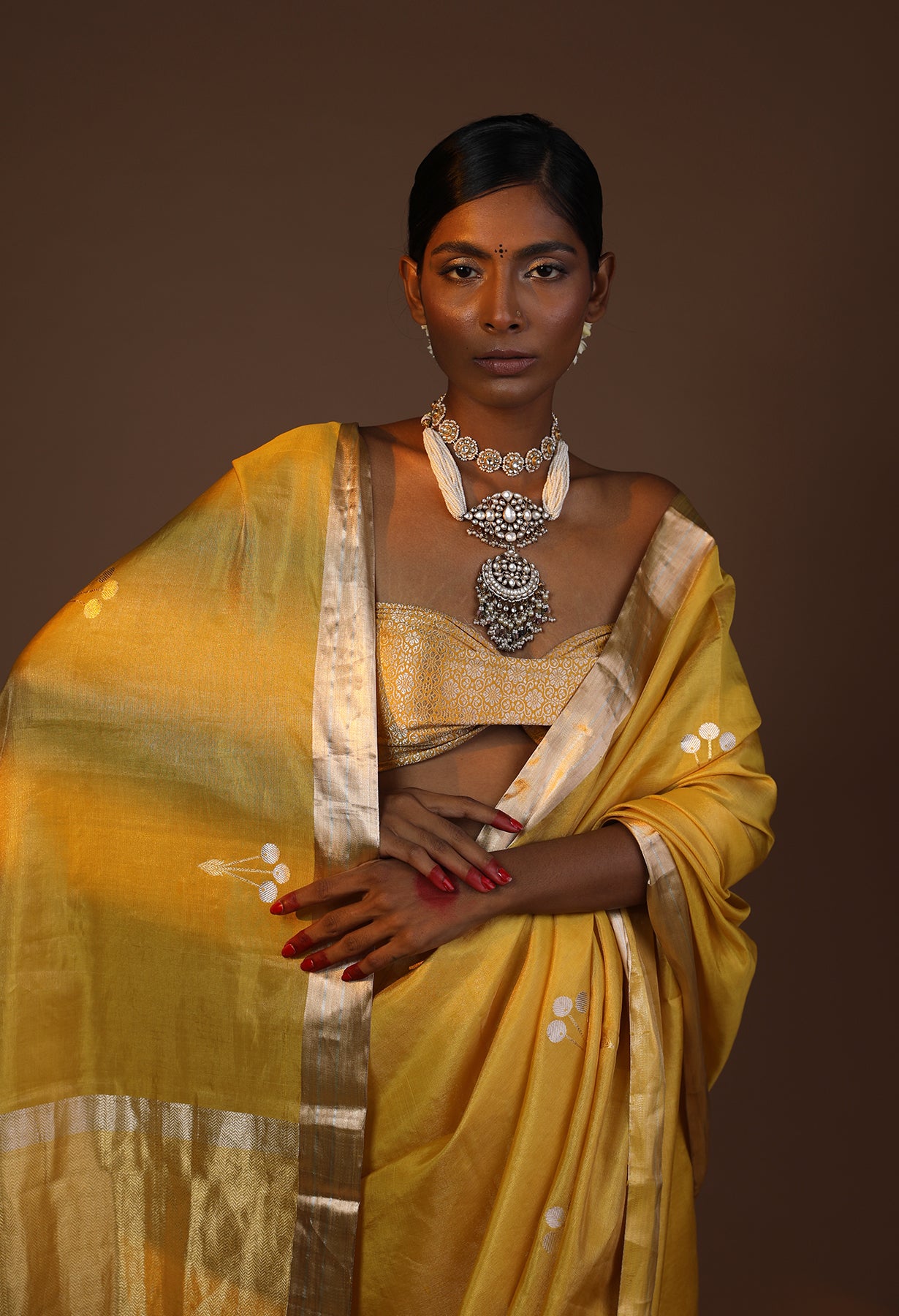 A Vibrant Yellow Tissue Silk Saree