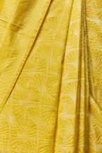 Pleated front of yellow saree with geometric motifs