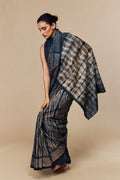 Front view of model in indigo-beige Shibori silk saree