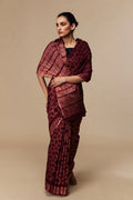 Model wearing wine red Shibori Chanderi silk cotton saree