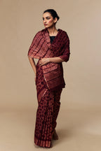 Model wearing wine red Shibori Chanderi silk cotton saree