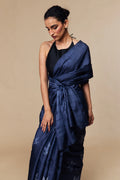 Model in indigo Tussar silk saree with leaf Shibori motifs