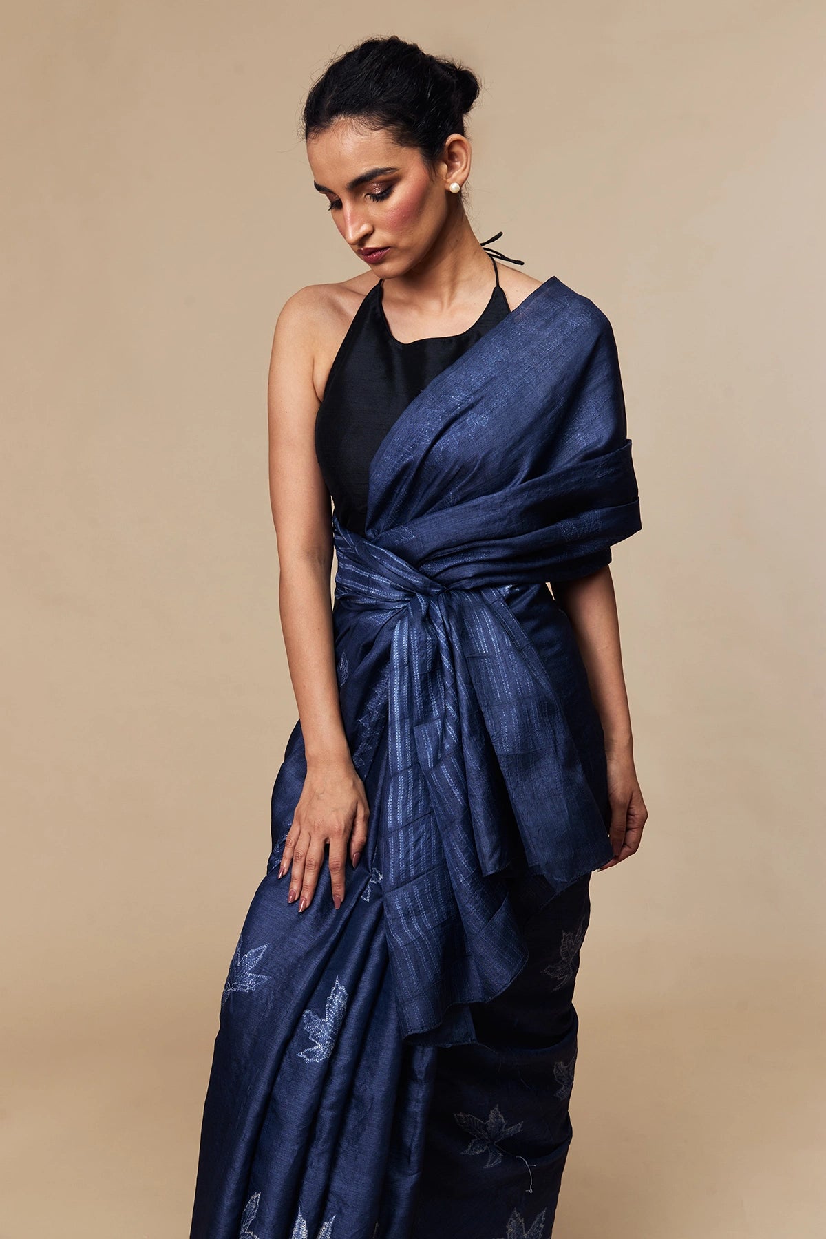 Model in indigo Tussar silk saree with leaf Shibori motifs