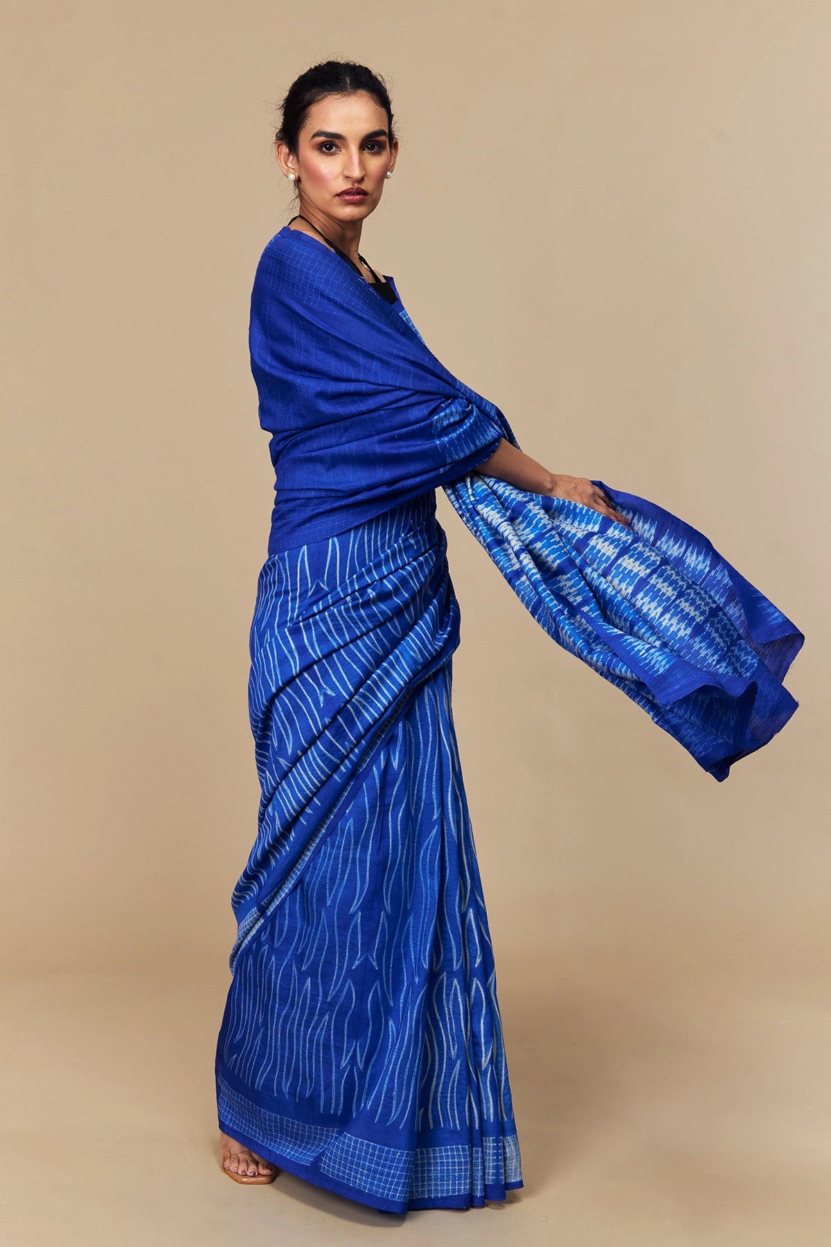 Model draped in electric blue Shibori mulberry silk saree