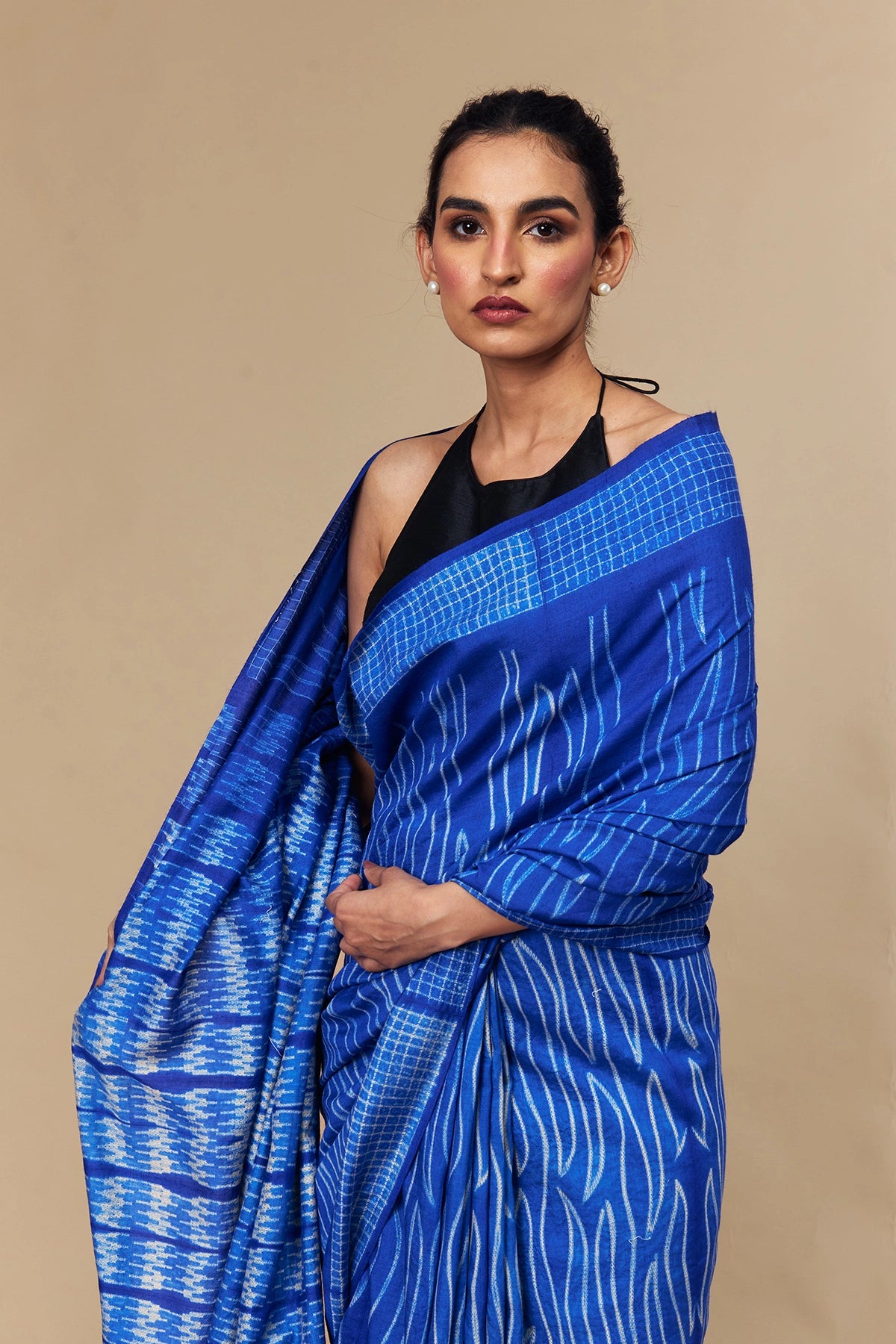 Close-up of modern Shibori patterns in wave and grid motifs